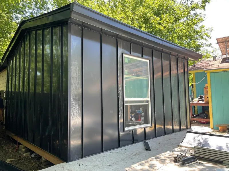 Black standing seam metal wall panels for Roof Inspection in Stowe